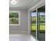 Living room features marble flooring, recessed lighting, and a sliding glass door leading to the outdoors at 14422 Chamberlain Blvd, Port Charlotte, FL 33953