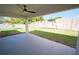 Enjoy the outdoors on this covered patio overlooking the lush backyard and privacy fence at 1536 Palmetto St, Clearwater, FL 33755