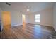 Bright bedroom with wood-look flooring, a ceiling fan, and natural light from a window at 1536 Palmetto St, Clearwater, FL 33755