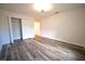 Bedroom boasting wood-look floors and a spacious closet at 1536 Palmetto St, Clearwater, FL 33755