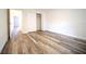Bright bedroom featuring wood-look flooring, a closet and white trim at 1536 Palmetto St, Clearwater, FL 33755