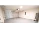 Spacious two-car garage with a smooth gray floor, bright lighting, and a door to the interior at 1536 Palmetto St, Clearwater, FL 33755