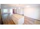 Open-concept kitchen featuring a large island, granite countertops, and modern stainless steel appliances at 1536 Palmetto St, Clearwater, FL 33755