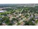 Aerial view showcasing the property's location within a neighborhood with lush greenery and nearby amenities at 1632 Ridge Top Way, Clearwater, FL 33765