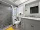 Bathroom featuring tiled shower and marble vanity at 1632 Ridge Top Way, Clearwater, FL 33765