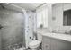 Bathroom with tiled shower, floral shower curtain, vanity with marble countertop, and a toilet at 1632 Ridge Top Way, Clearwater, FL 33765