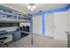 Bedroom featuring carpet floors, loft bed, and two closets with white paneled doors at 1632 Ridge Top Way, Clearwater, FL 33765