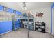 A fun bedroom featuring a lofted bed over a built-in desk, with bright blue accent walls at 1632 Ridge Top Way, Clearwater, FL 33765