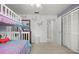 A bedroom featuring a bunk bed and butterflies at 1632 Ridge Top Way, Clearwater, FL 33765