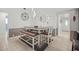 Bright dining area featuring modern lighting and a stylish bench at 1632 Ridge Top Way, Clearwater, FL 33765