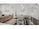 Modern dining room area with stylish pendant lights and a bench at 1632 Ridge Top Way, Clearwater, FL 33765