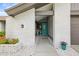A charming entryway featuring a teal door and brick accents at 1632 Ridge Top Way, Clearwater, FL 33765