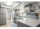 Bright kitchen featuring white countertops and tiled backsplash at 1632 Ridge Top Way, Clearwater, FL 33765