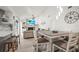 Open floor plan with views of the living room with fireplace and adjacent dining area at 1632 Ridge Top Way, Clearwater, FL 33765