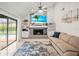 Living room with fireplace and backyard access at 1632 Ridge Top Way, Clearwater, FL 33765