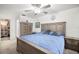 Bedroom featuring ceiling fan, ample natural light, closet, and ensuite bathroom at 1632 Ridge Top Way, Clearwater, FL 33765
