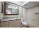 A traditional bathroom featuring tiled walls, vanity with granite top, and tiled bath tub at 17 Freshwater Dr, Palm Harbor, FL 34684