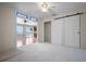 Bedroom with view to waterfront and renovated bathroom with barn door at 17 Freshwater Dr, Palm Harbor, FL 34684