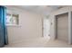 Comfortable bedroom with neutral carpet, a window, and a closet at 17 Freshwater Dr, Palm Harbor, FL 34684