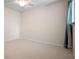 Simple bedroom with neutral carpet, ceiling fan and small closet at 17 Freshwater Dr, Palm Harbor, FL 34684
