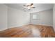 Bright, spacious bedroom with hardwood floors, a window, and a ceiling fan at 17 Freshwater Dr, Palm Harbor, FL 34684