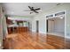Open floor plan with a kitchen featuring an island and a spacious living room with hardwood floors at 17 Freshwater Dr, Palm Harbor, FL 34684