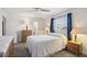 Calm bedroom with a neutral palette, side tables, and an ensuite bathroom at 1732 Flamingo Ln, Sun City Center, FL 33573