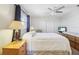 Relaxing bedroom with a ceiling fan, natural light, and soft carpet at 1732 Flamingo Ln, Sun City Center, FL 33573