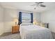 Serene bedroom with a comfortable bed, carpet, and warm lighting from bedside lamps at 1732 Flamingo Ln, Sun City Center, FL 33573