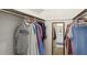 Walk-in closet with clothing and mirrors, and with a view into the adjacent bathroom at 1732 Flamingo Ln, Sun City Center, FL 33573