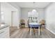 Cozy dining area with a round table, wooden chairs, and a window with natural light at 1732 Flamingo Ln, Sun City Center, FL 33573