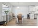 Bright dining room featuring modern light fixture and views of the backyard at 1732 Flamingo Ln, Sun City Center, FL 33573