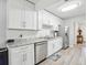 Eat-in Kitchen featuring modern appliances, bright countertops, and sleek cabinetry at 1732 Flamingo Ln, Sun City Center, FL 33573