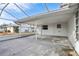 Covered patio with concrete floor, offering an ideal space for outdoor entertaining and relaxation at 1732 Flamingo Ln, Sun City Center, FL 33573