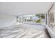 Enclosed patio with concrete floor, windows and screen, providing a versatile outdoor living area at 1732 Flamingo Ln, Sun City Center, FL 33573