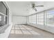 Bright sunroom with abundant natural light, ceiling fan, and neutral flooring, perfect for relaxation at 1732 Flamingo Ln, Sun City Center, FL 33573