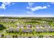 An aerial view of townhomes with manicured lawns in a well-planned community at 17378 Cruiser Bnd, Land O Lakes, FL 34638