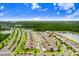 A high angle aerial view of newly constructed townhomes near a lake at 17378 Cruiser Bnd, Land O Lakes, FL 34638