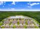 A high angle aerial view of townhomes that back to a lake at 17378 Cruiser Bnd, Land O Lakes, FL 34638