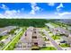Aerial view of the property showcasing its location within a landscaped community with water views at 17378 Cruiser Bnd, Land O Lakes, FL 34638