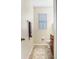 Cozy half bathroom with a tile floor, a decorative rug, and warm neutral wall paint at 17378 Cruiser Bnd, Land O Lakes, FL 34638