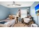 Cozy bedroom featuring playful decor, natural light, and a comfortable layout at 17378 Cruiser Bnd, Land O Lakes, FL 34638