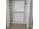 An open closet with shelves and closet rods offers storage space and organization at 17378 Cruiser Bnd, Land O Lakes, FL 34638