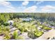 Aerial view of a community park, pool, and recreation area amidst lush greenery at 17378 Cruiser Bnd, Land O Lakes, FL 34638