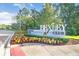 Entrance to Bexley Club featuring lush landscaping and clear signage for the community amenities at 17378 Cruiser Bnd, Land O Lakes, FL 34638