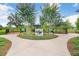 Entrance to the Bark Yard dog park, featuring well-maintained landscaping and convenient access for pet owners at 17378 Cruiser Bnd, Land O Lakes, FL 34638