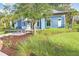 Exterior view of a fitness center with lush landscaping, and bike racks at 17378 Cruiser Bnd, Land O Lakes, FL 34638