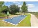 Community outdoor fitness station with various exercise equipment and an instructional sign at 17378 Cruiser Bnd, Land O Lakes, FL 34638