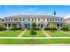 Townhome exterior with well-maintained lawn and coordinated exterior color scheme at 17378 Cruiser Bnd, Land O Lakes, FL 34638