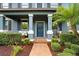 Inviting front porch and entry of the townhome, featuring landscaping at 17378 Cruiser Bnd, Land O Lakes, FL 34638